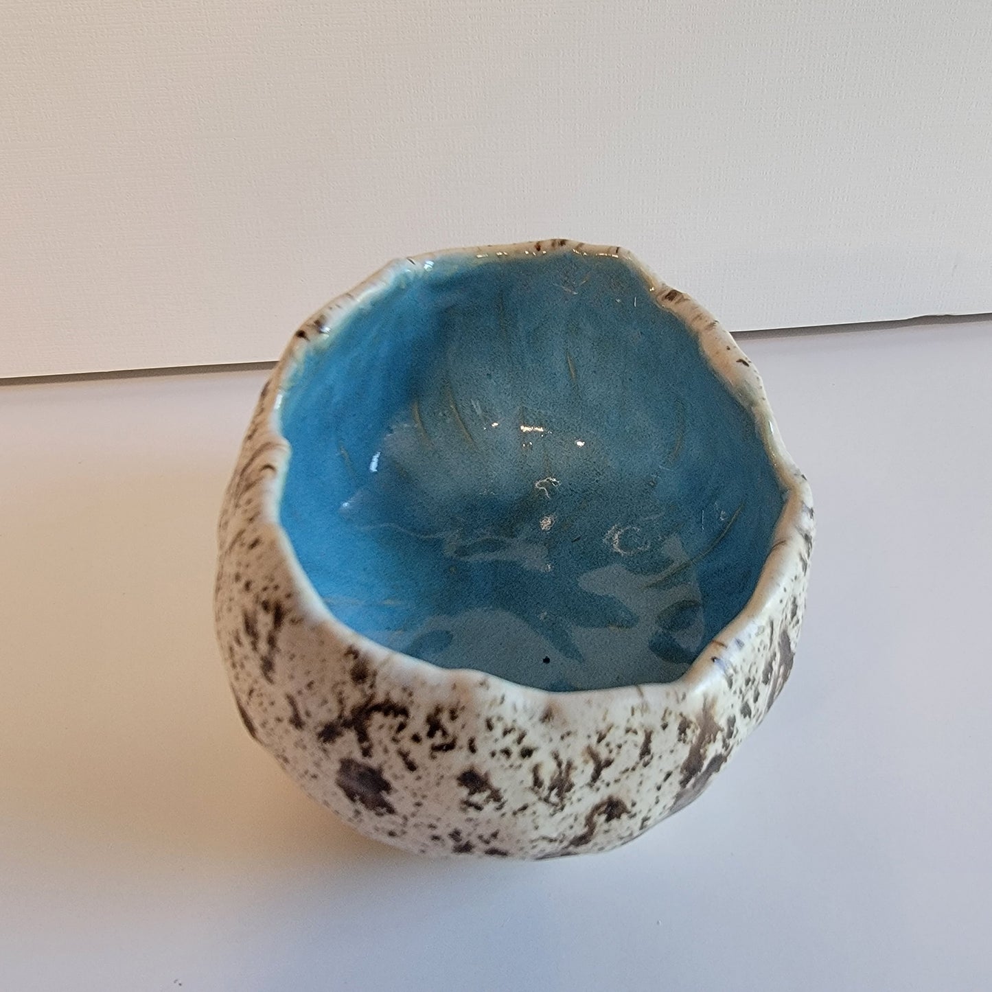 Handbuilt cracked egg shaped bowl