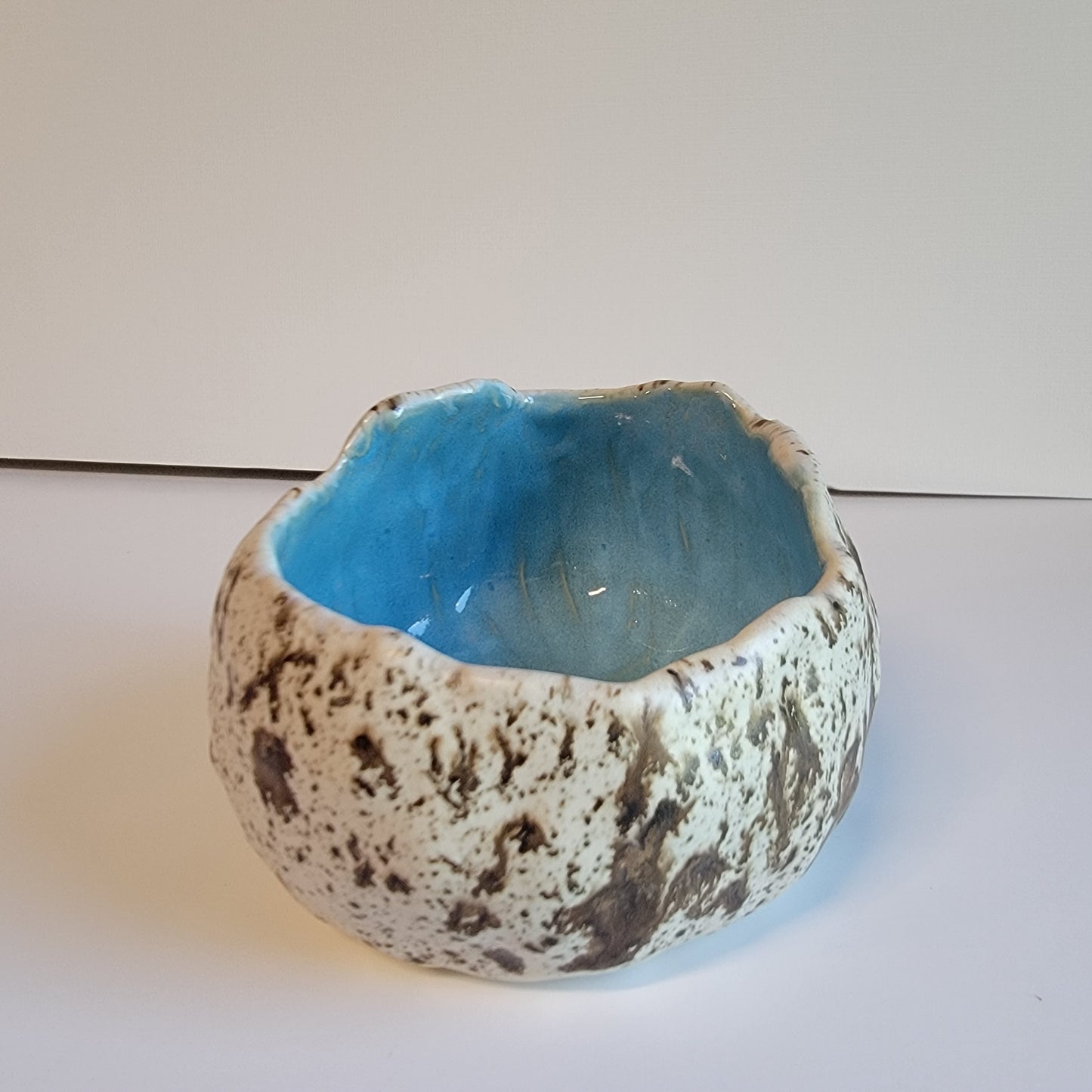 Handbuilt cracked egg shaped bowl